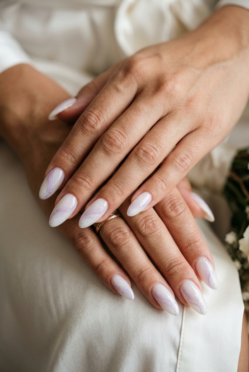 Lavender swirls milk bath medium coffin nails for summer wedding nails 2026. Whimsical, dreamy, romantic style.