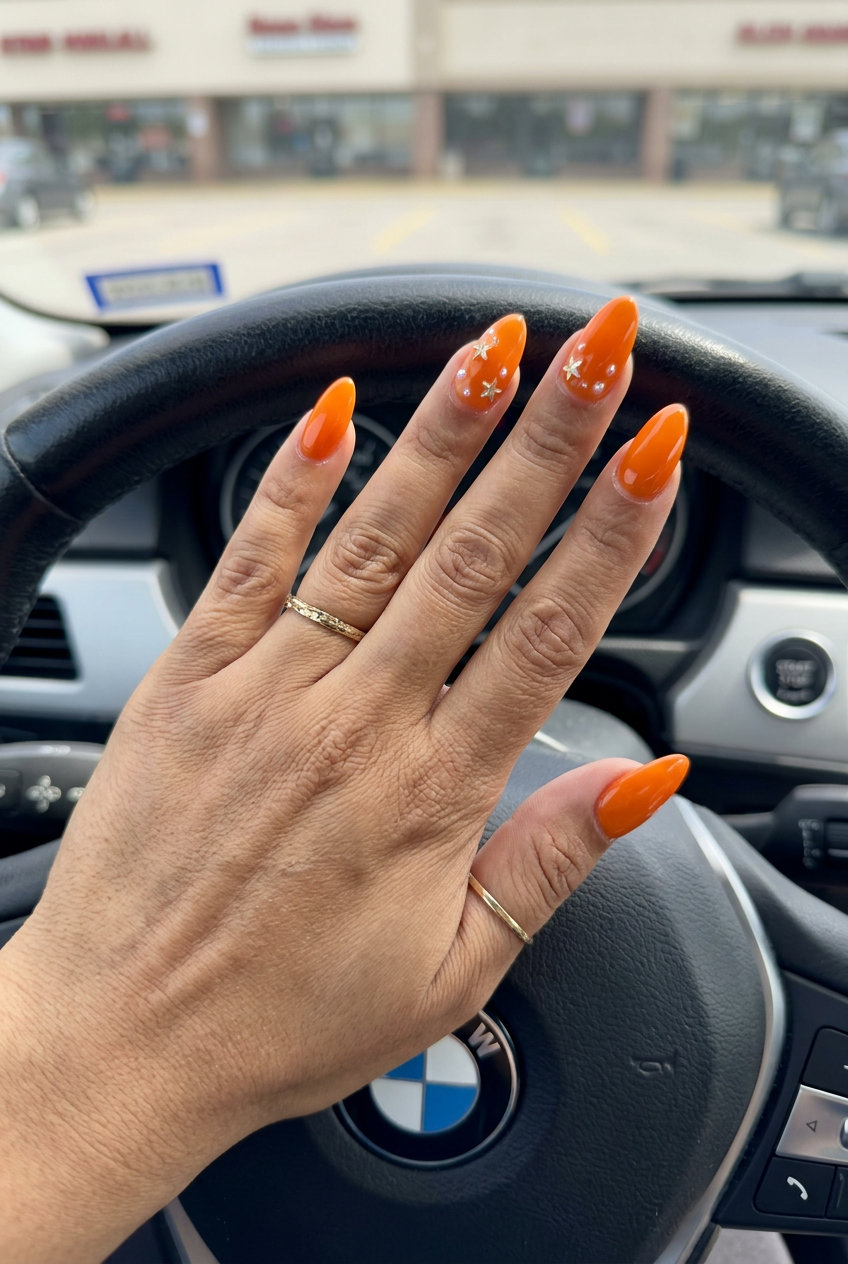 Trending Summer Nails 2026: Fun Coral Charms Trending summer nails 2026: Coral pop charms almond nails for a fun summer party or vacation look.