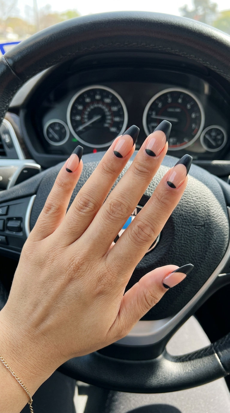 Midnight oasis reverse French tip nails for vacation french nails summer 2026. Chic matte black crescent on nude base.