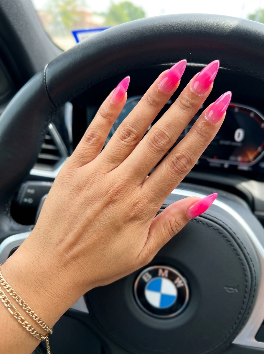 Hot pink jelly stiletto nails with gradient for vibrant nails summer 2026. Sultry date night vacation style.