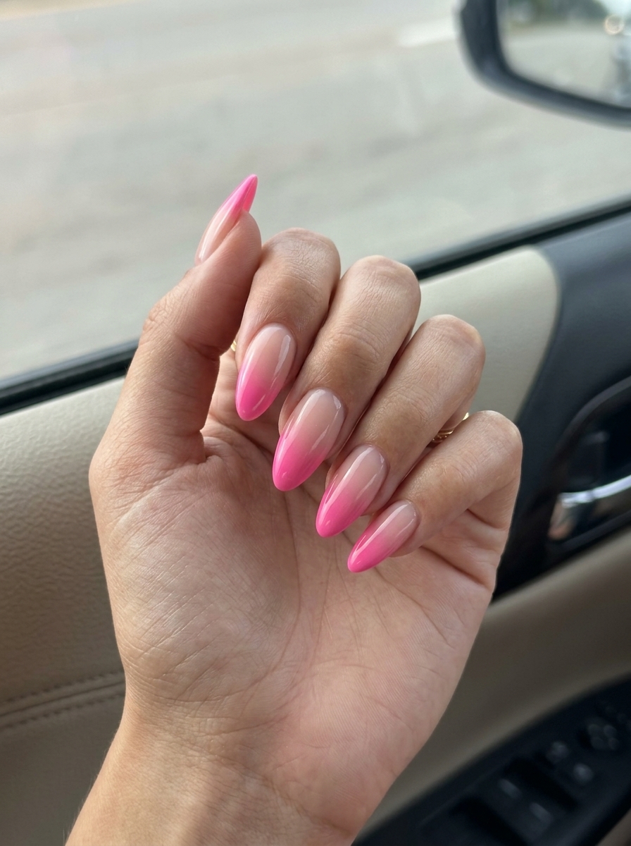 Hot pink sunset ombre almond nails for vibrant nails summer 2026. Romantic brunch wedding guest style.