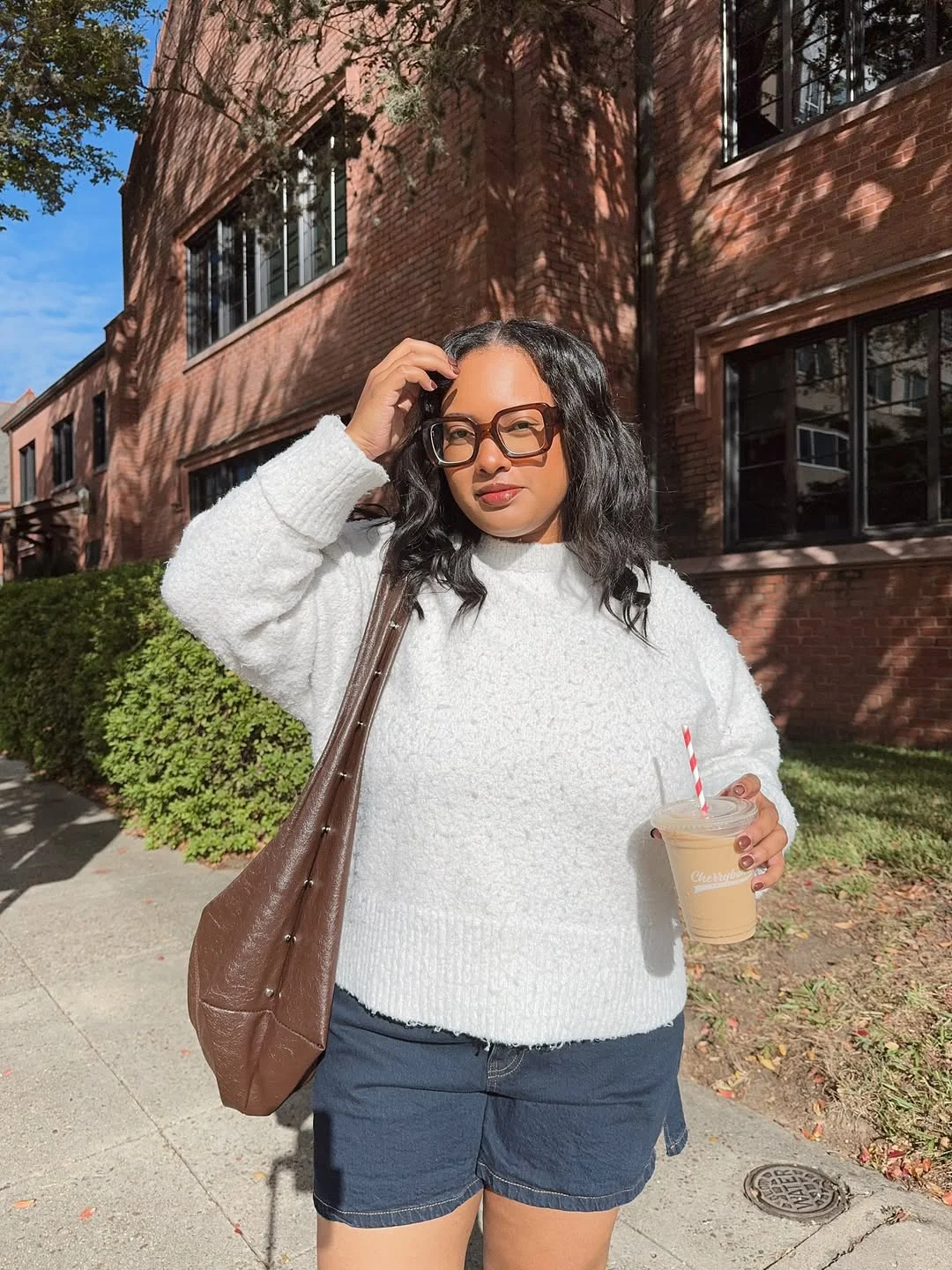 Early fall outfits ideas 2026 Cozy White Sweaters and Shorts Create the Perfect Late Summer Balance
