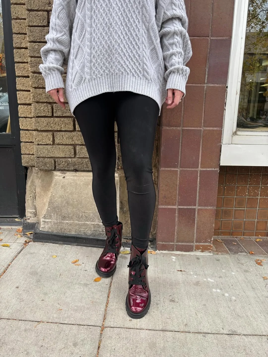 fall outfits with boots and leggings 2026 Chunky Knit Sweater with Glossy Combat Boots