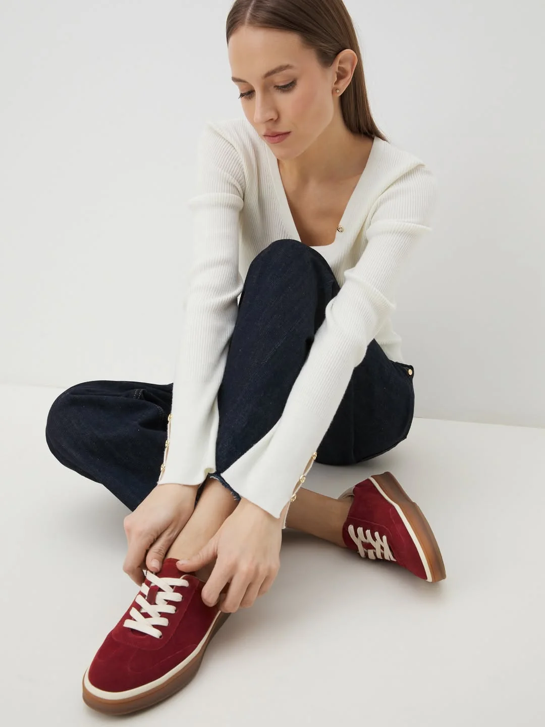 fall outfits with sneakers 2026 Burgundy Sneakers With Dark Denim and Soft Knitwear