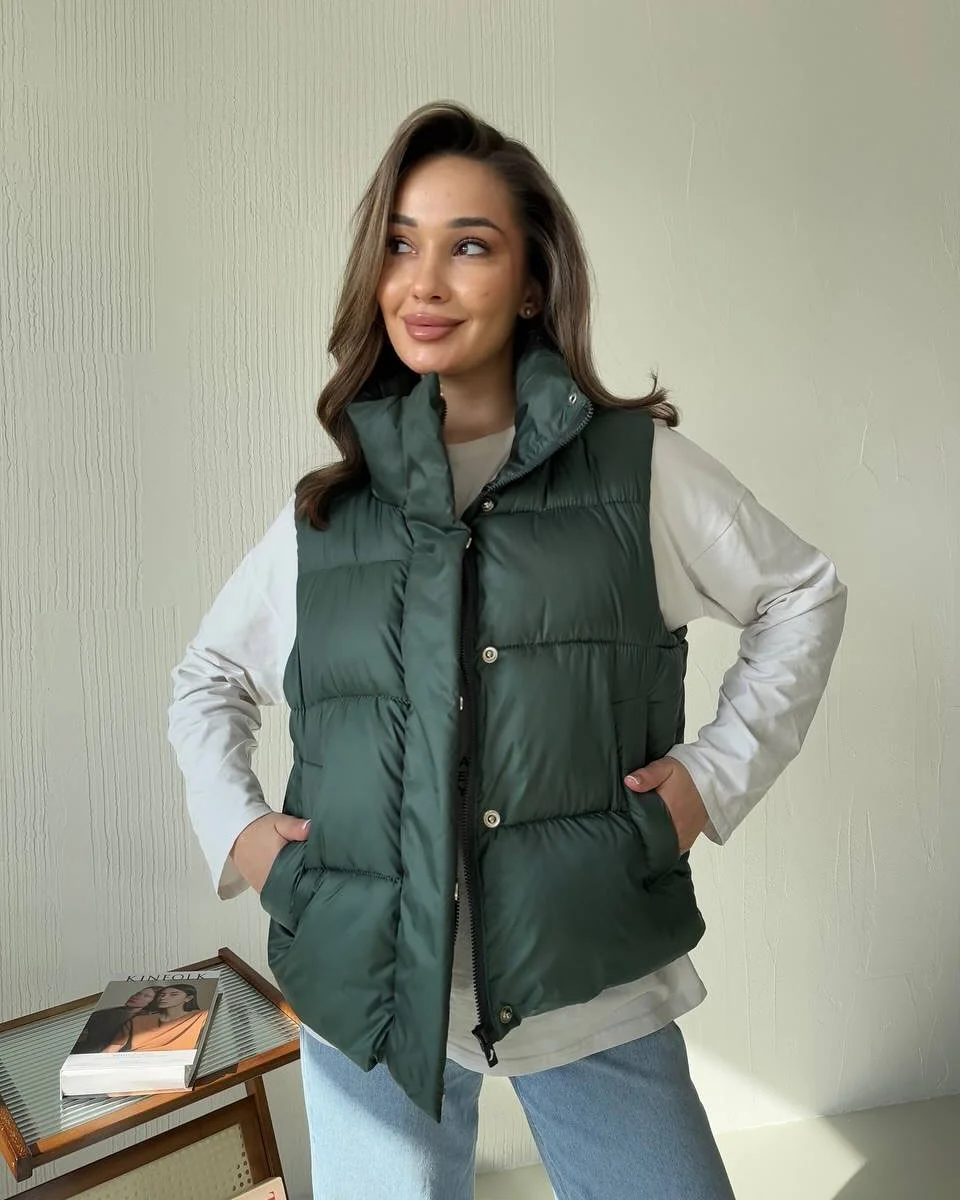 fall outfits with vests 2026 Deep Green Puffer Vest with Relaxed Everyday Denim