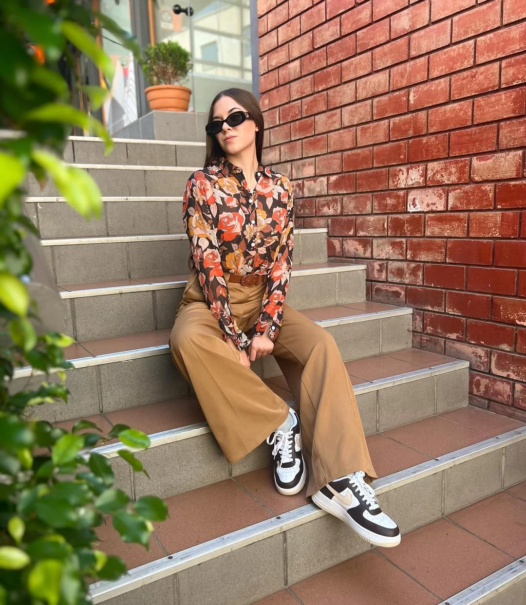 fall smart casual office outfits women 2026 Relaxed Camel Trousers With a Vintage-Inspired Floral Blouse