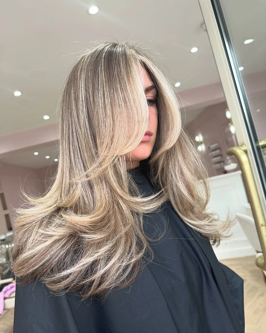 babylights hair ideas Soft Mushroom Blonde with Feathered Curtain Layers