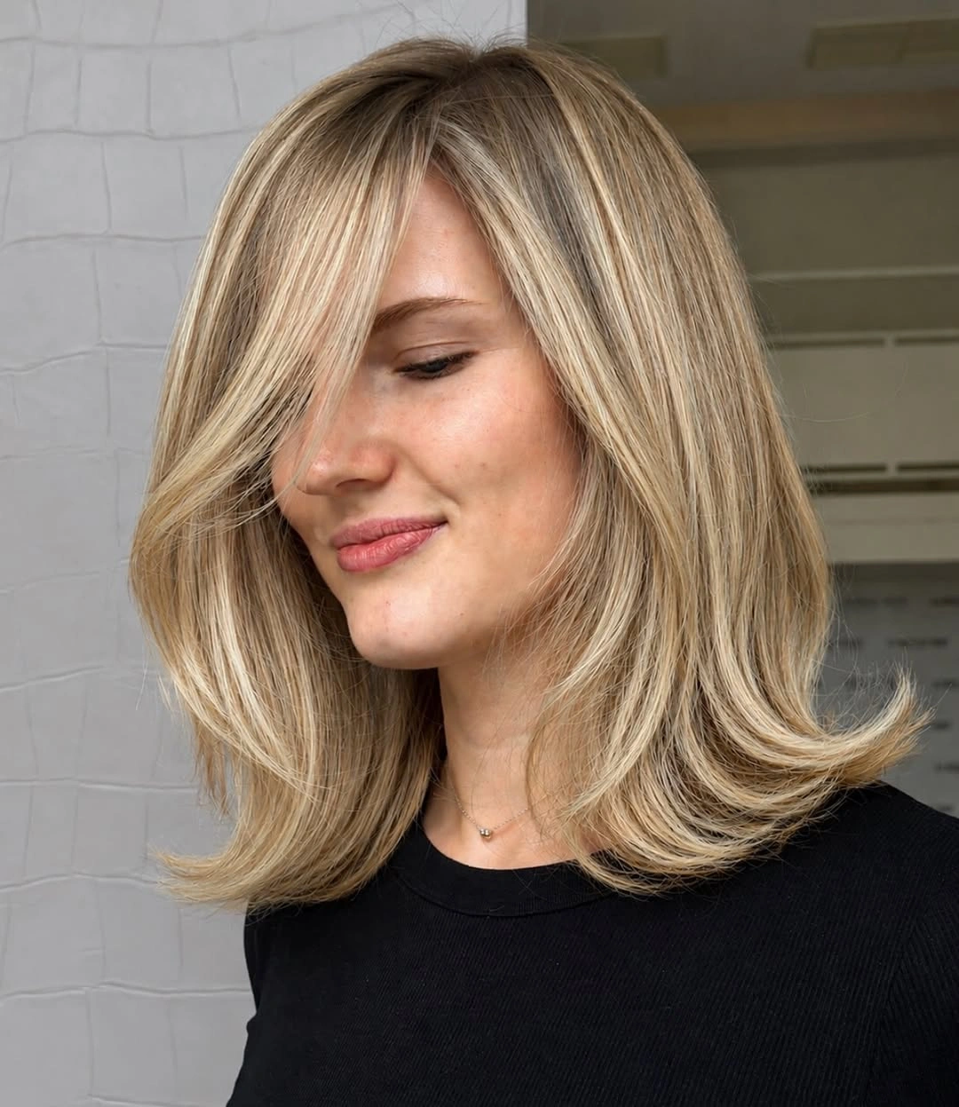 beige blond hair color Feathered Beige Blonde Bob with Elegant Volume