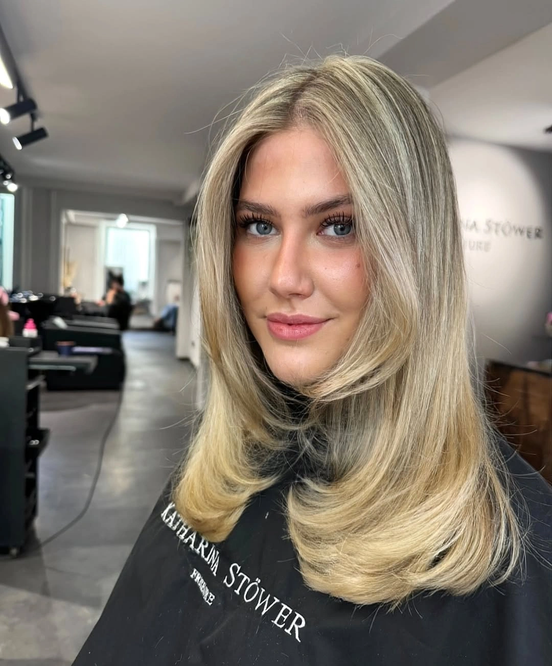 beige blond hair color Classic Beige Blonde Blowout with Face-Framing Layers