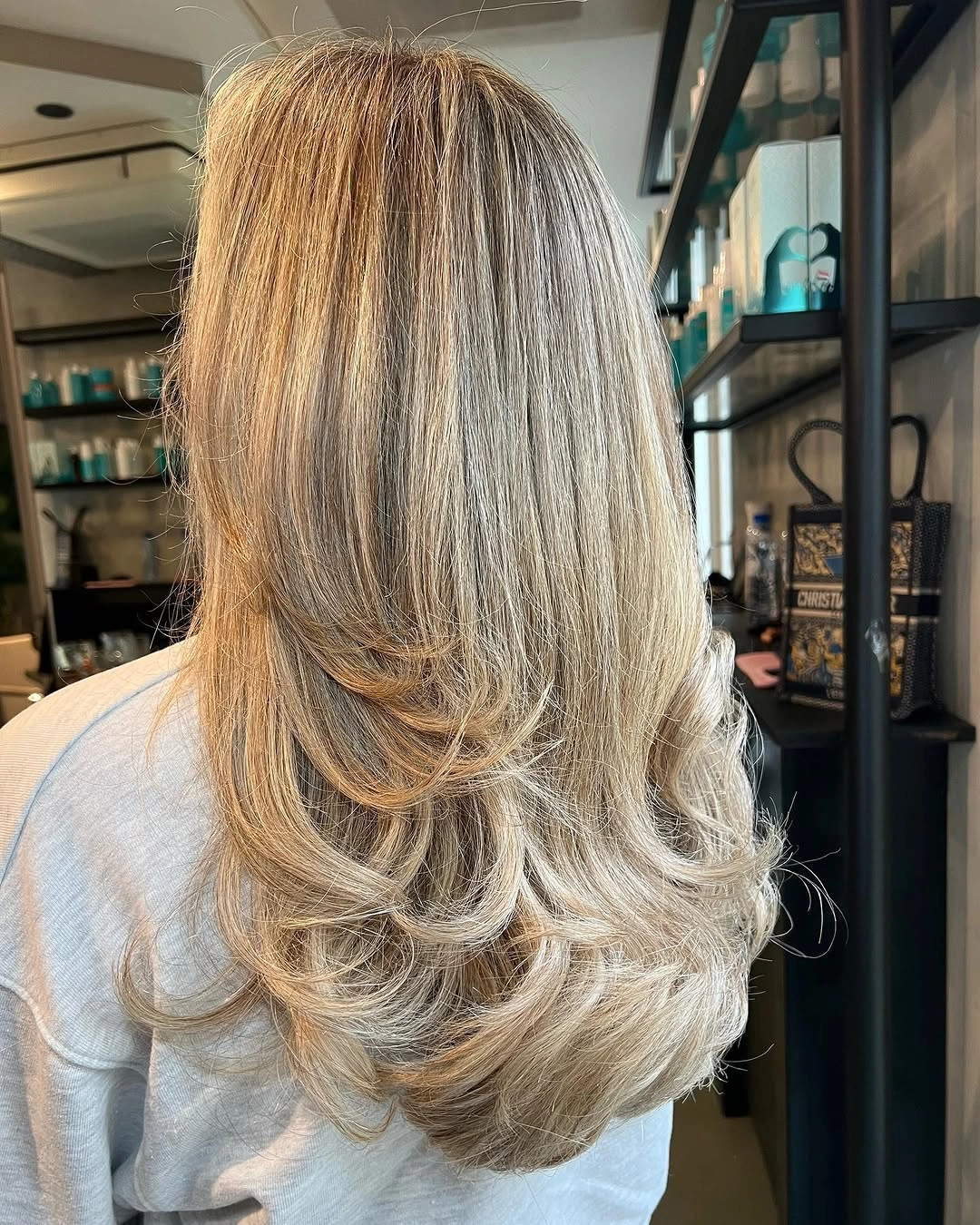 beige blond hair color Feathered Beige Blonde Layers with Salon-Level Volume