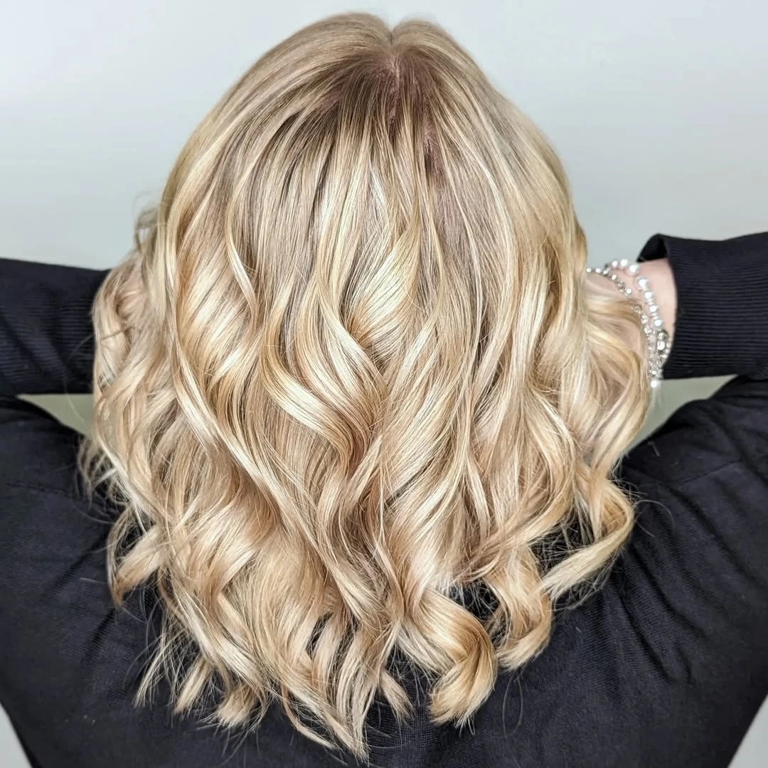 beige blond hair color Glossy Beige Blonde Waves with Soft Champagne Dimension