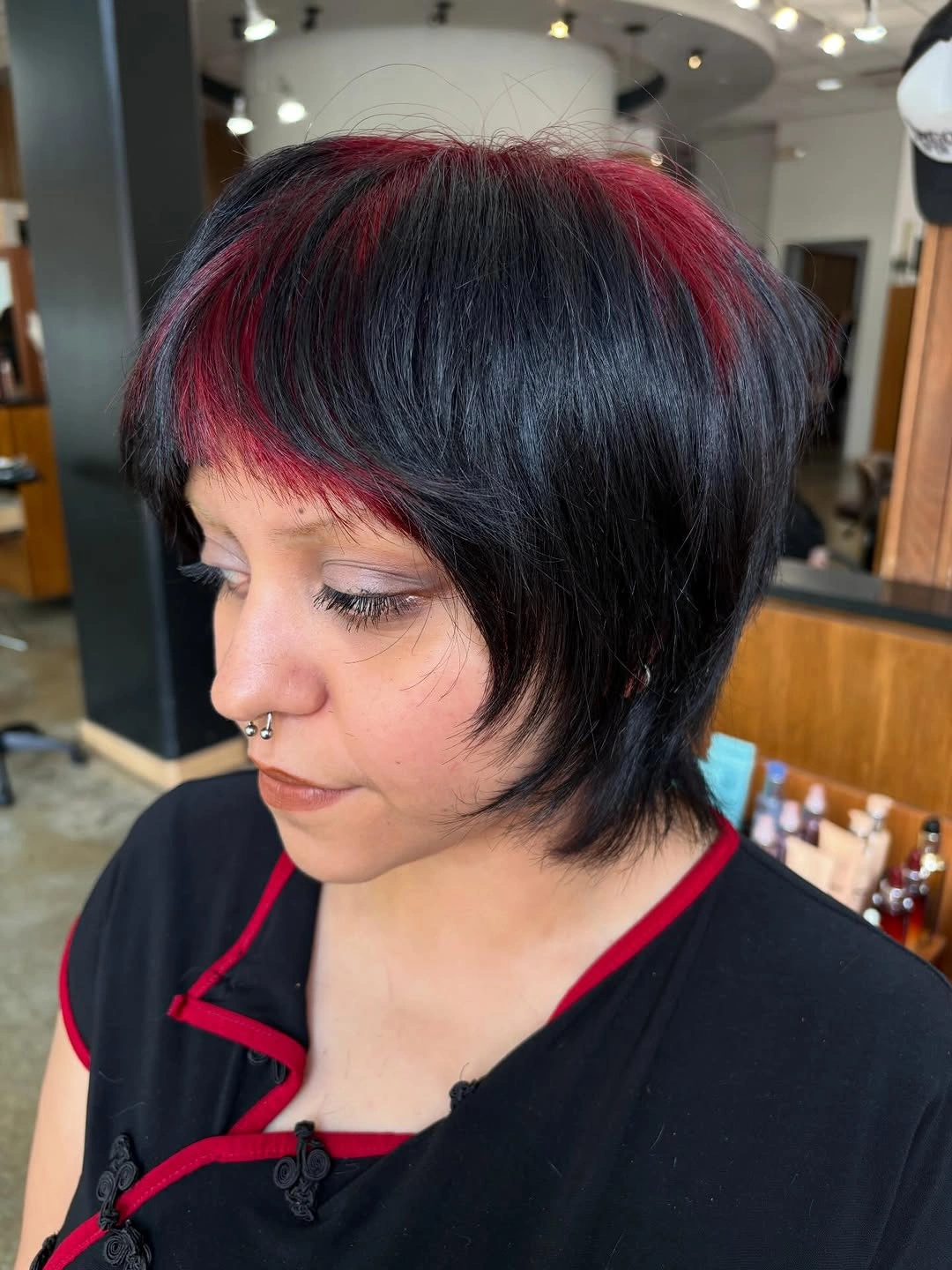 bixie haircut Bold Black Bixie with Crimson Accent Highlights
