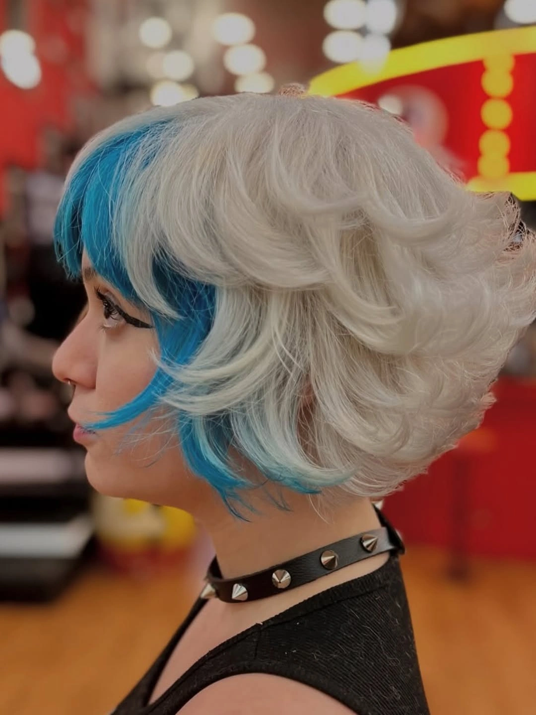 bixie haircut Bold Ice Blonde with Electric Blue Statement Pieces