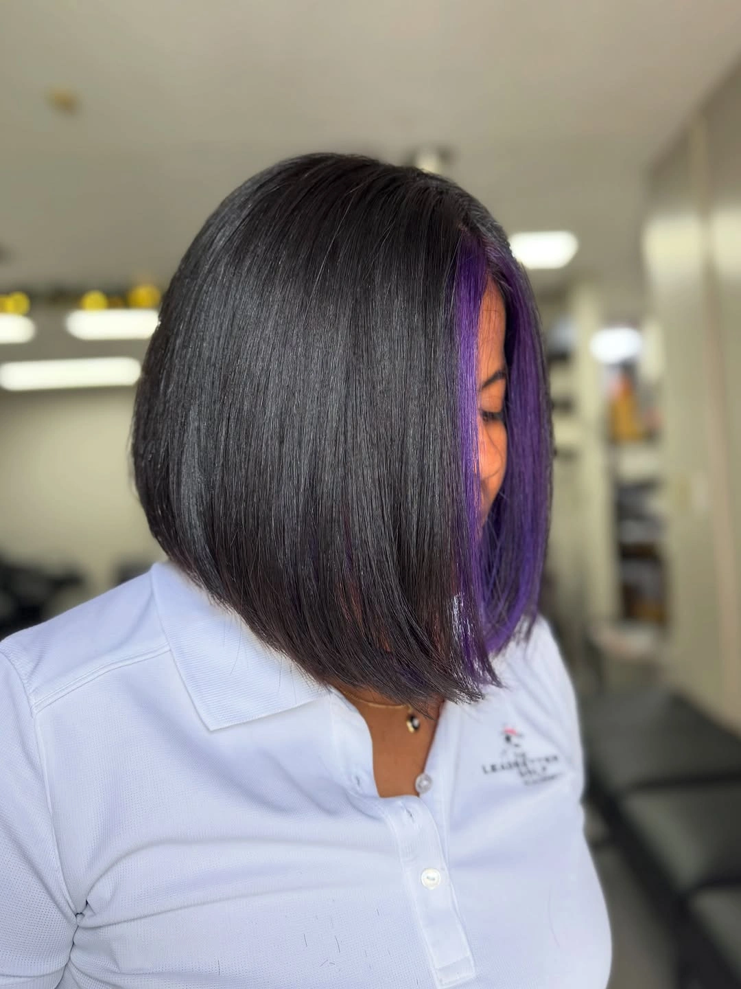 bob hairstyles for black women Angled Black Bob With A Purple Front Streak