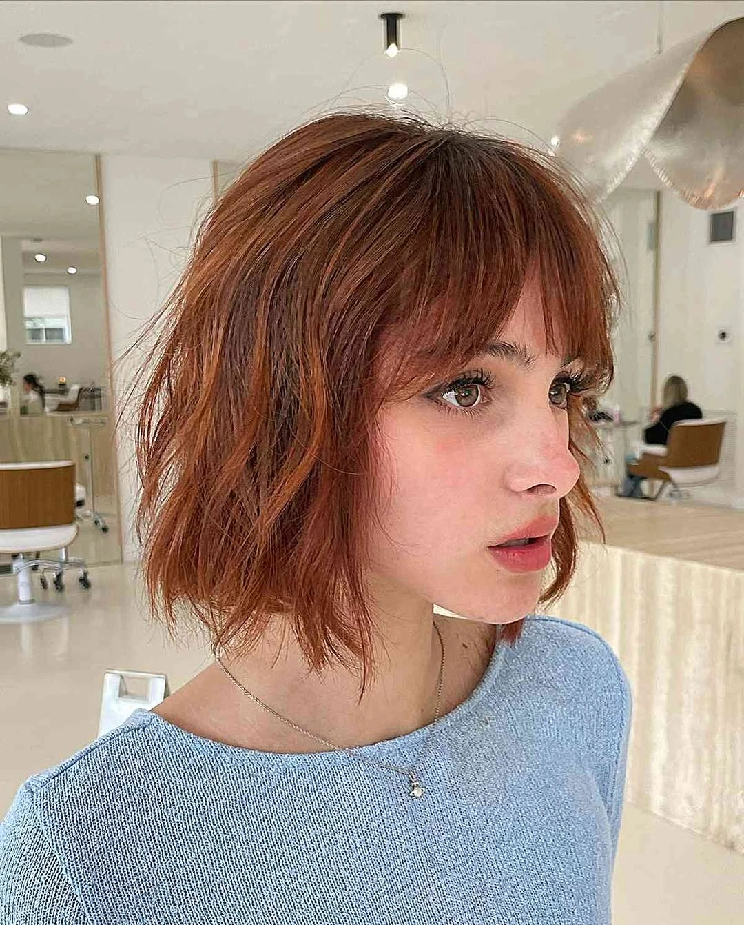 bobbed haircut for women Textured Copper Bob With Wispy Layers