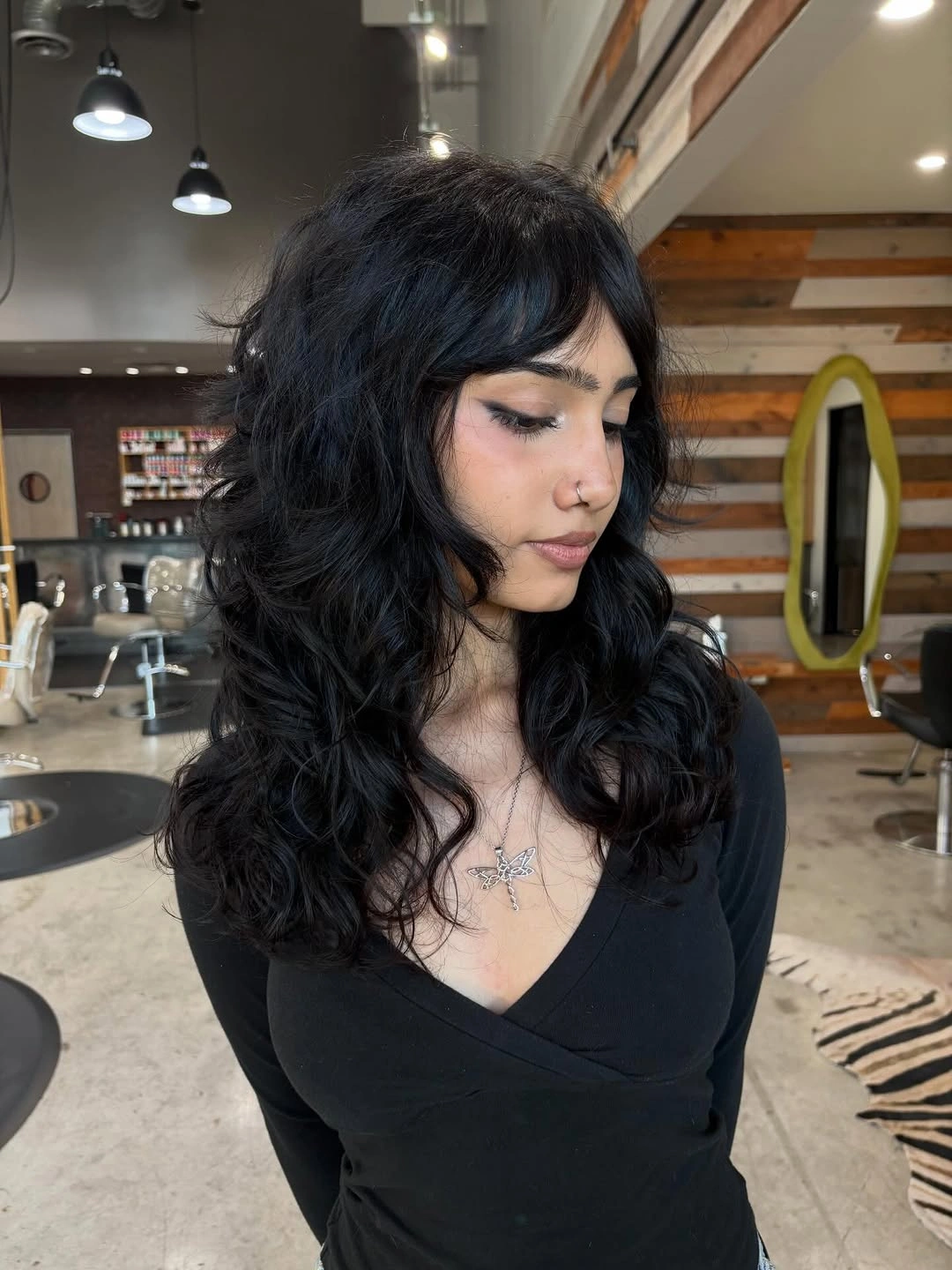 body waves hairstyle Classic Black Waves With Soft Layers and Fringe