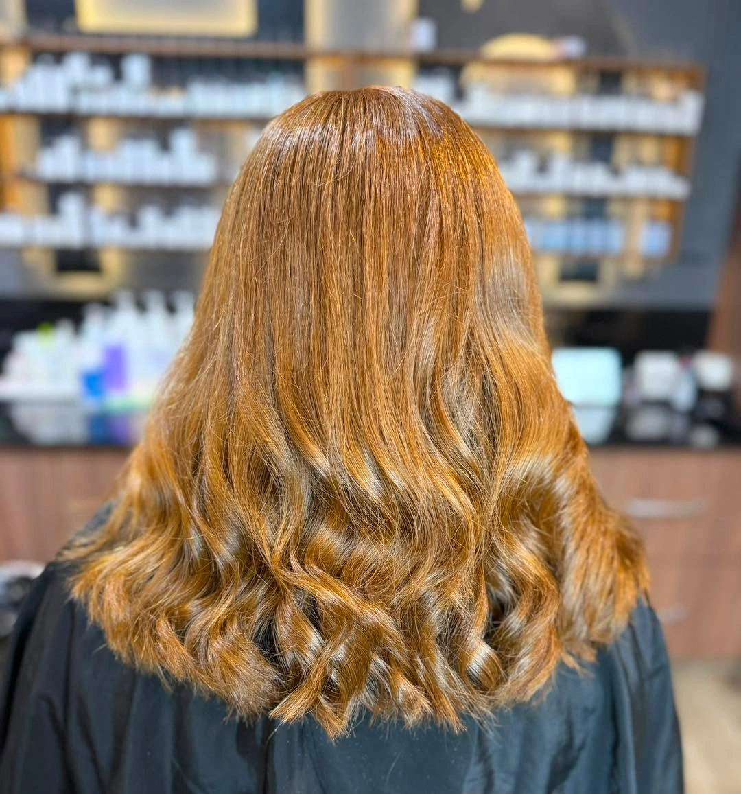 body waves hairstyle Golden Caramel Mid-Length Waves With Healthy Shine