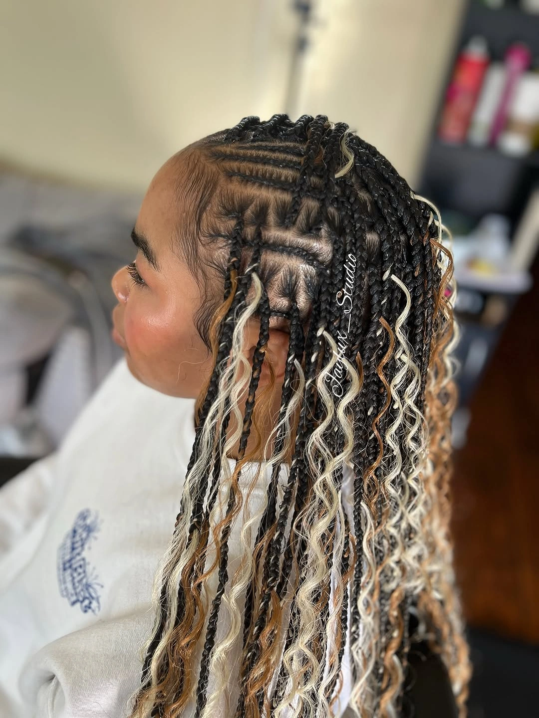 bora bora braids hairstyle Statement Parting With High-Contrast Accent Braids