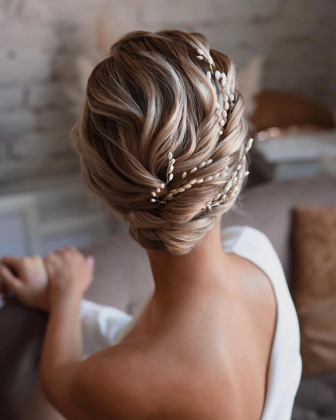 bridesmaid hairstyling Graceful Bridal Chignon With Pearl Vine Details