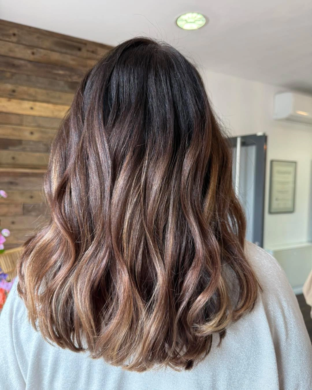 dimensional brunette hair color Rich Brunette Waves With Warm Back-View Ends