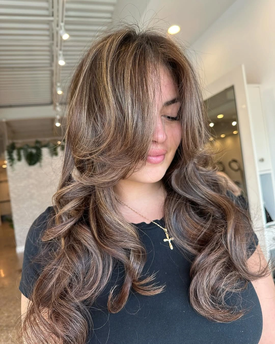 dimensional brunette hair color Voluminous Brunette Blowout With Light Ribbons