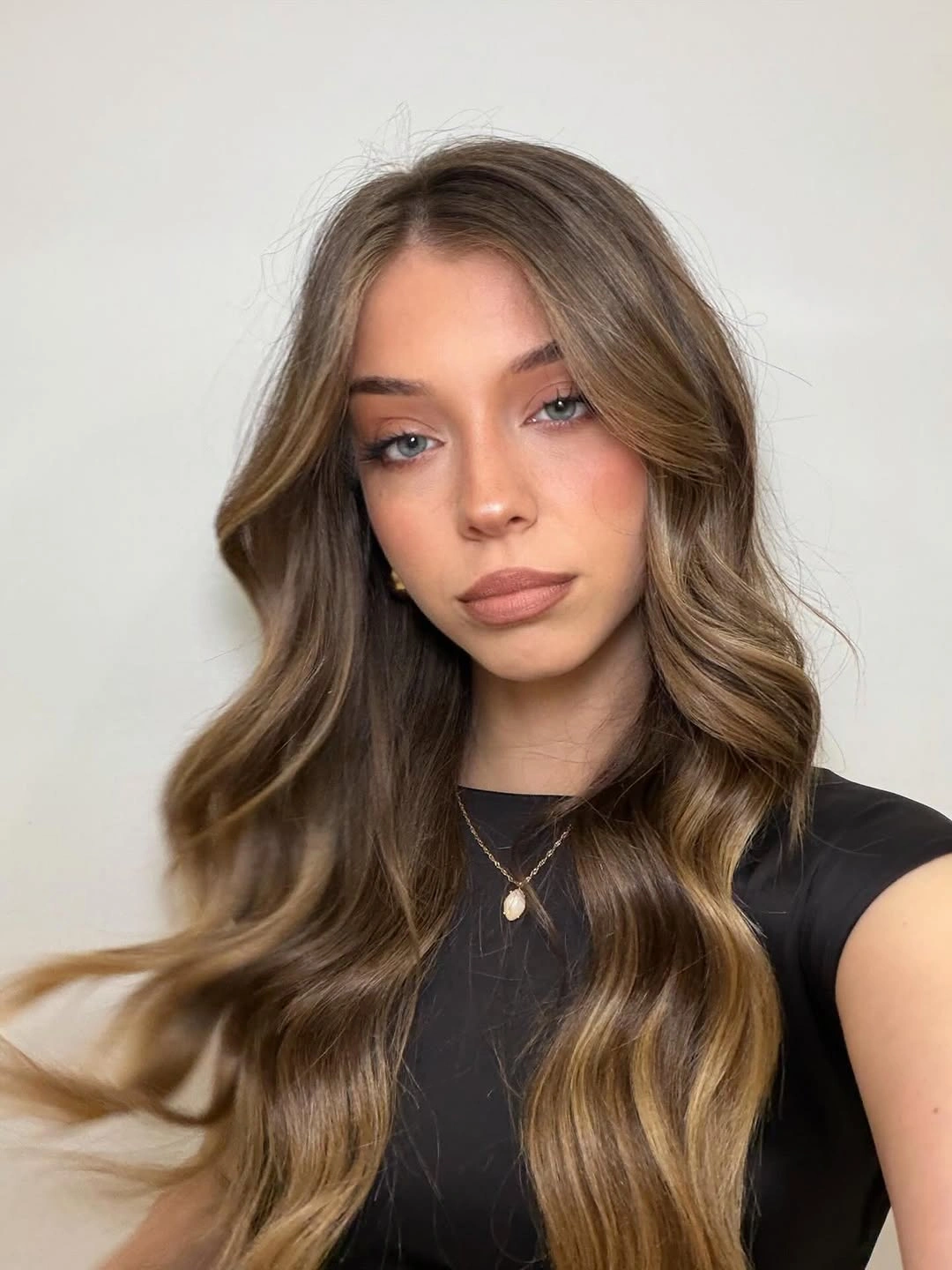 dimensional brunette hair color Golden Brunette Ribbons Through Long Waves