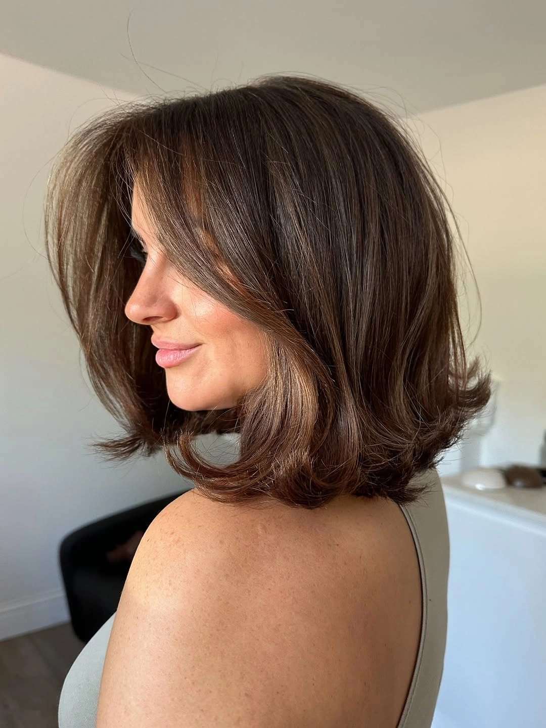 dimensional brunette hair color Rounded Brunette Lob With Flipped Ends