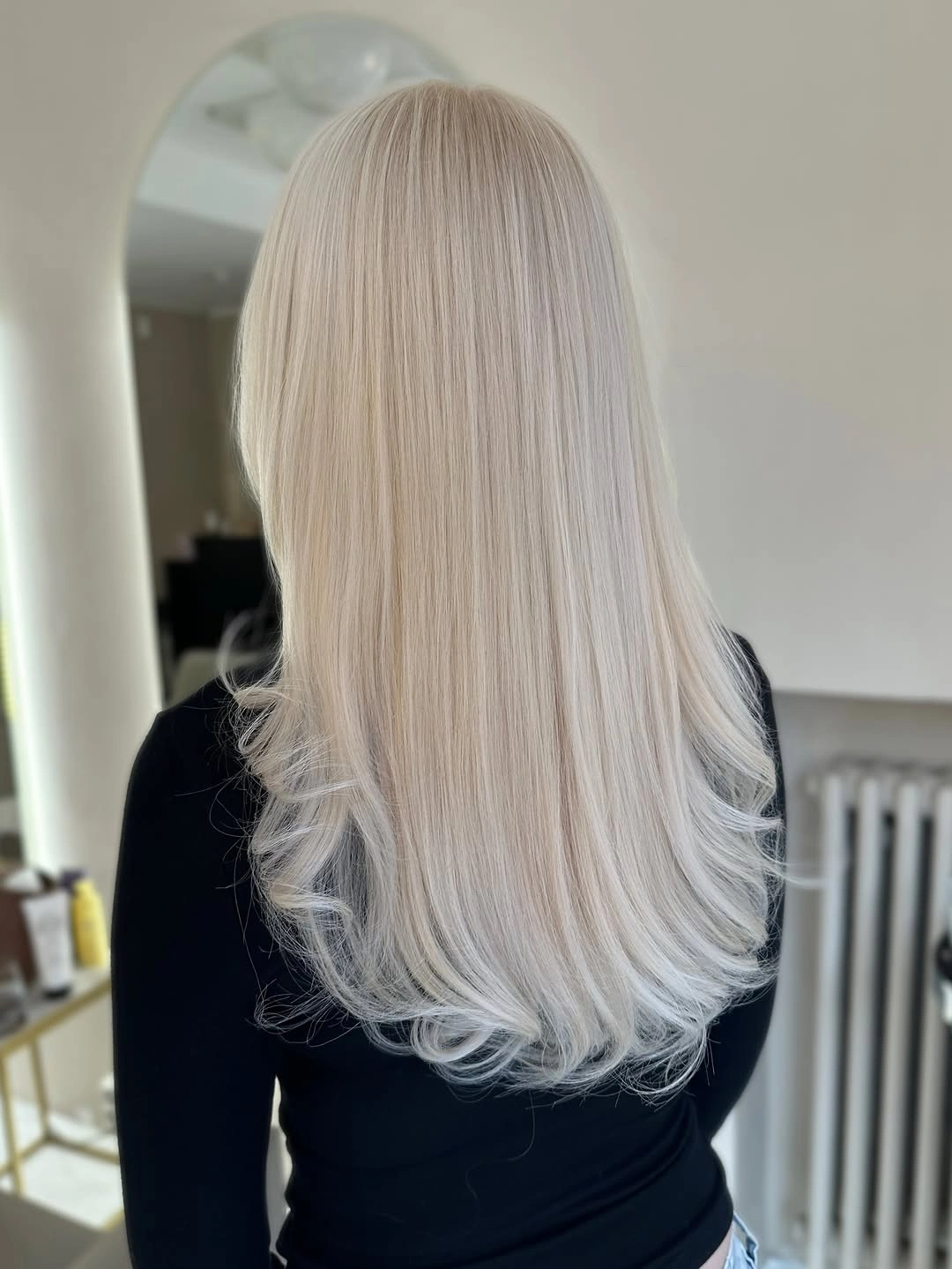 Fall blonde hair colour 2026 Silky Arctic Blonde With Feathered Ends