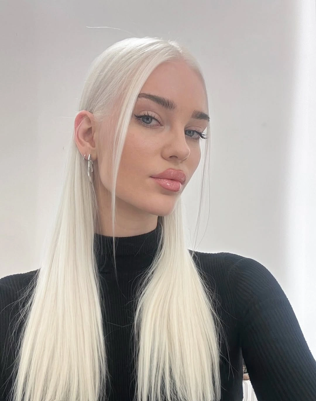 Fall blonde hair colour 2026 Crystal Ice Blonde With Sleek Glass-Hair Shine