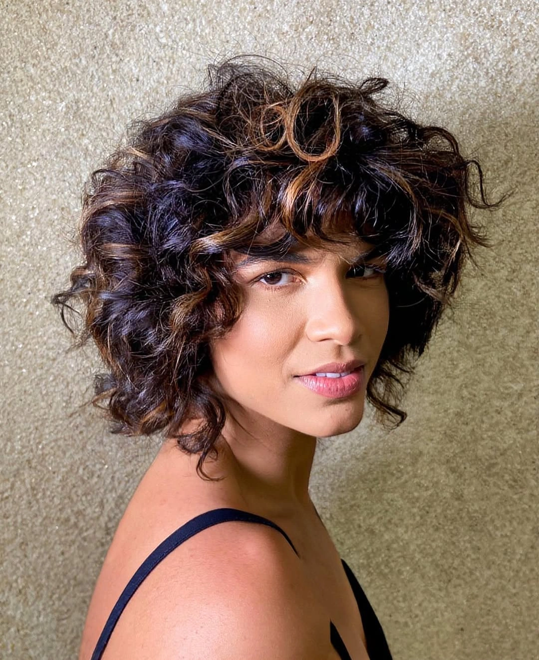 Fall brunette hair colour 2026 Curly French Bob with Cinnamon Accent Pieces