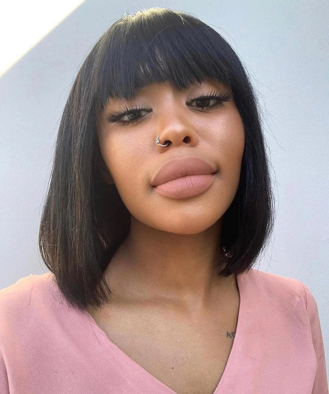 fall hair colors for black women 2026 Classic Jet Black Bob With Full Fringe Elegance