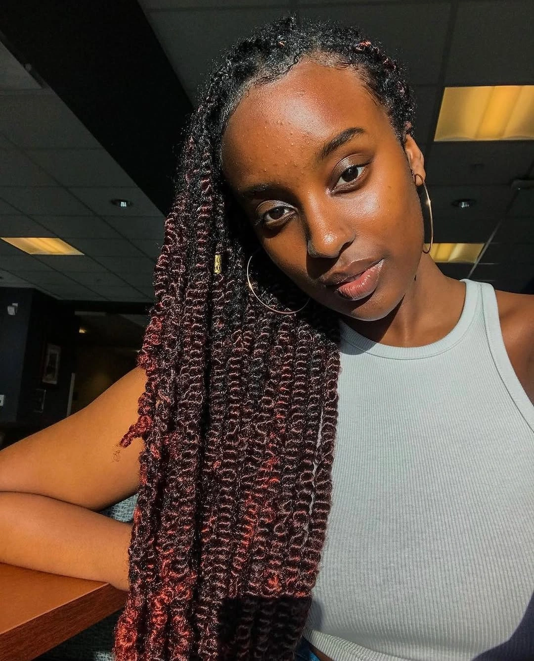 fall hair colors for black women 2026 Dark Cherry Passion Twists With Cozy Autumn Warmth
