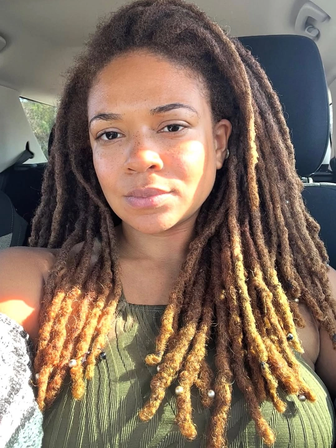fall hair colors for black women 2026 Caramel Ombre Locs With Warm Autumn Glow