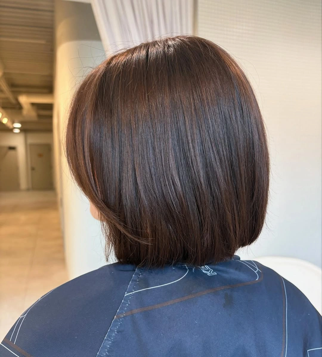 fall hair colour ideas 2026 Rich Espresso Bob With Glass Hair Shine