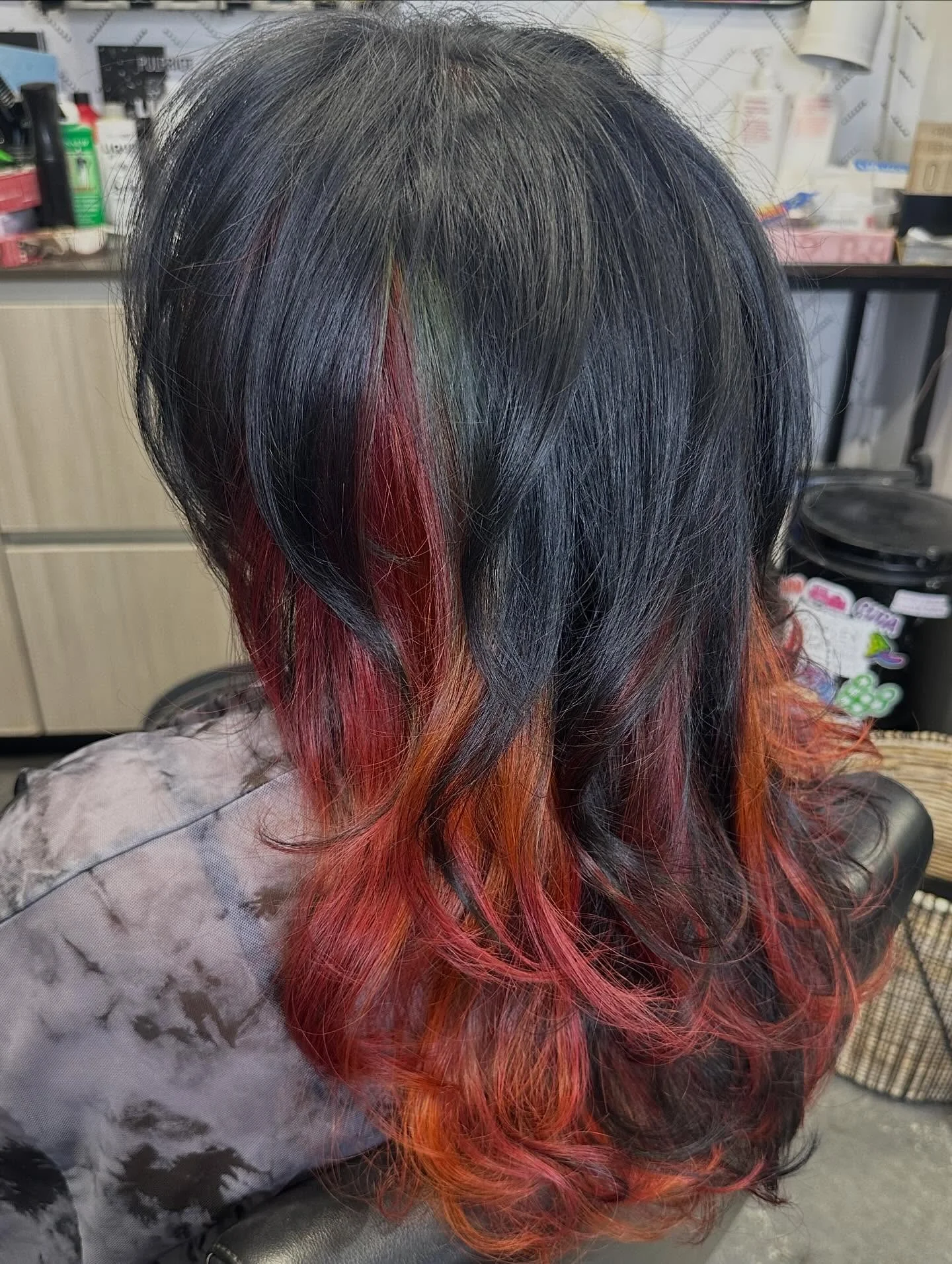 fall hair colour ideas 2026 Hidden Ember Highlights Beneath Midnight Hair