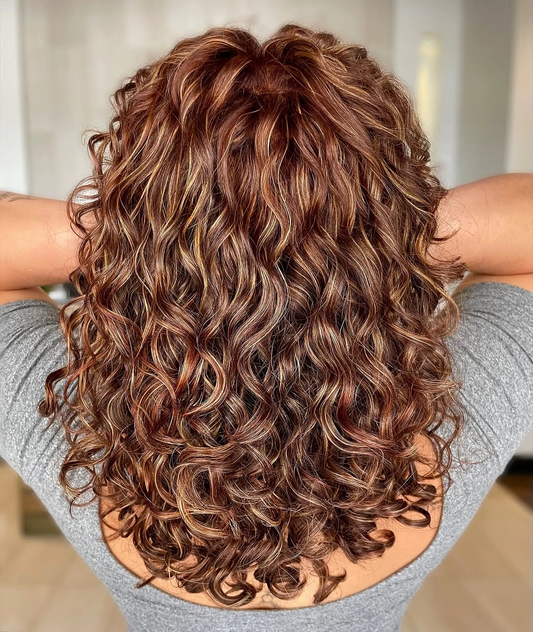 fall hair colour ideas 2026 Golden Cinnamon Curls Full Of Dimension
