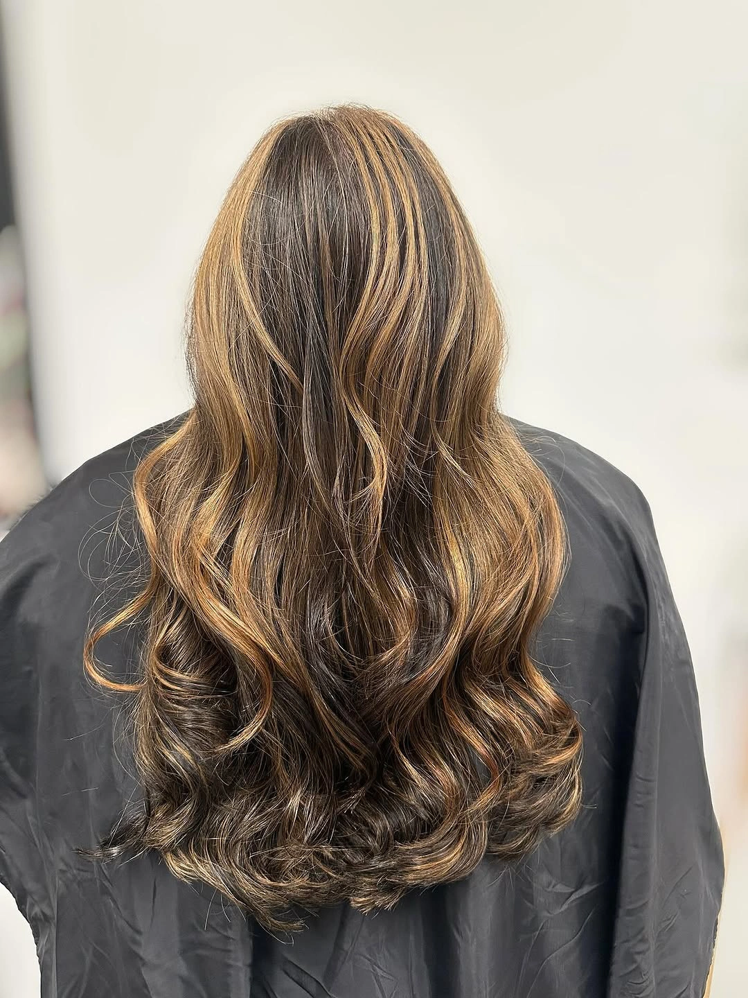 fall hair colour ideas 2026 Golden Mocha Balayage With Luxury Shine