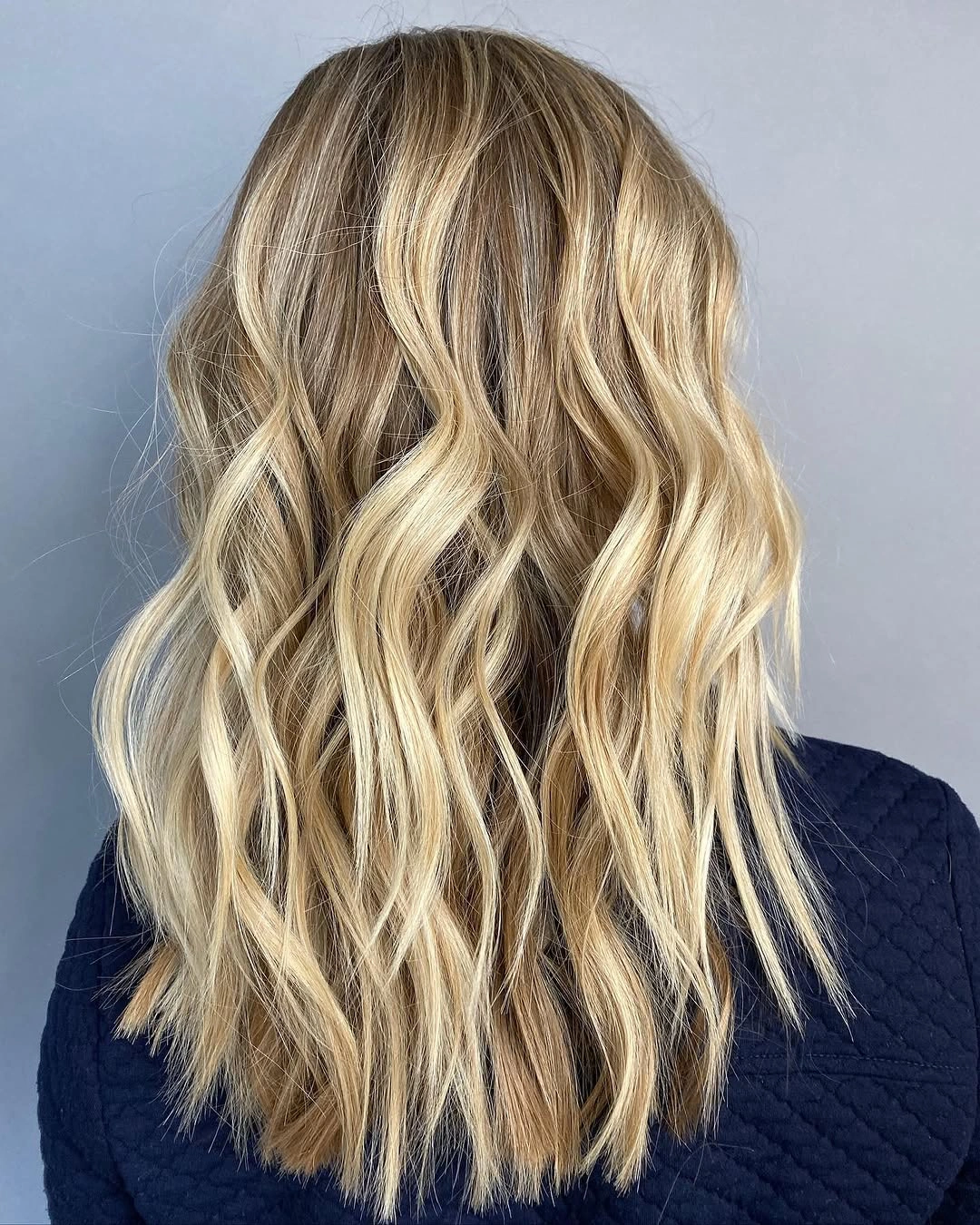 fall haircuts for women 2026 Soft Beach Waves With Bright Blonde Dimension