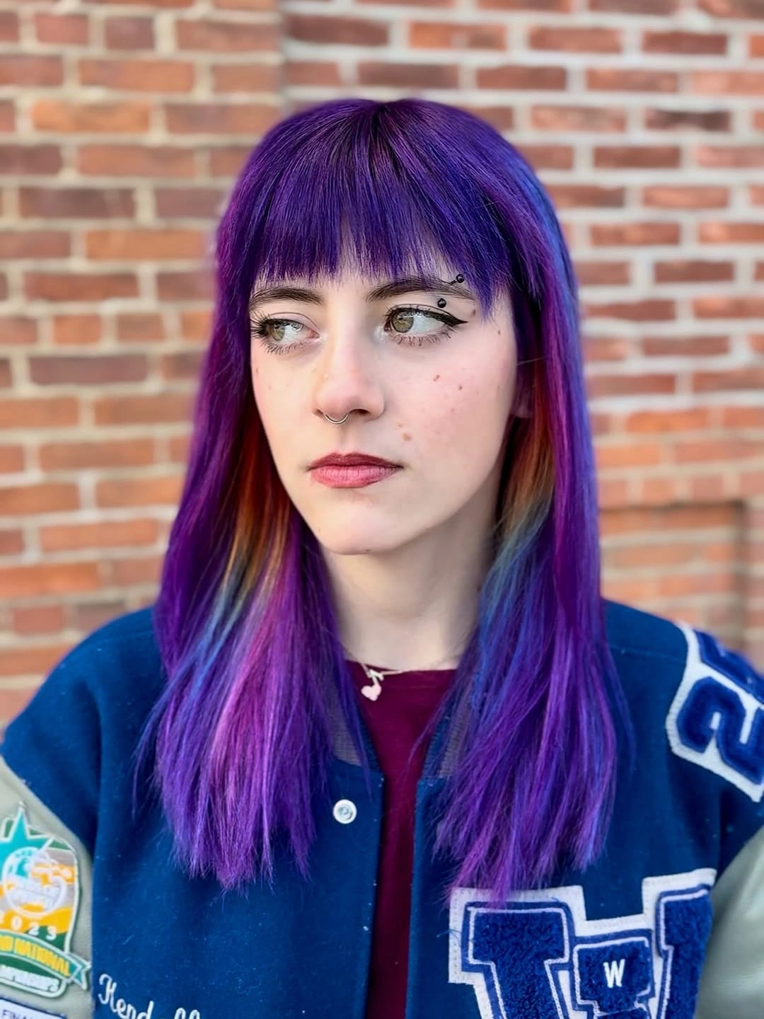 fall haircuts for women 2026 Vivid Violet Layers With Bold Micro Bangs
