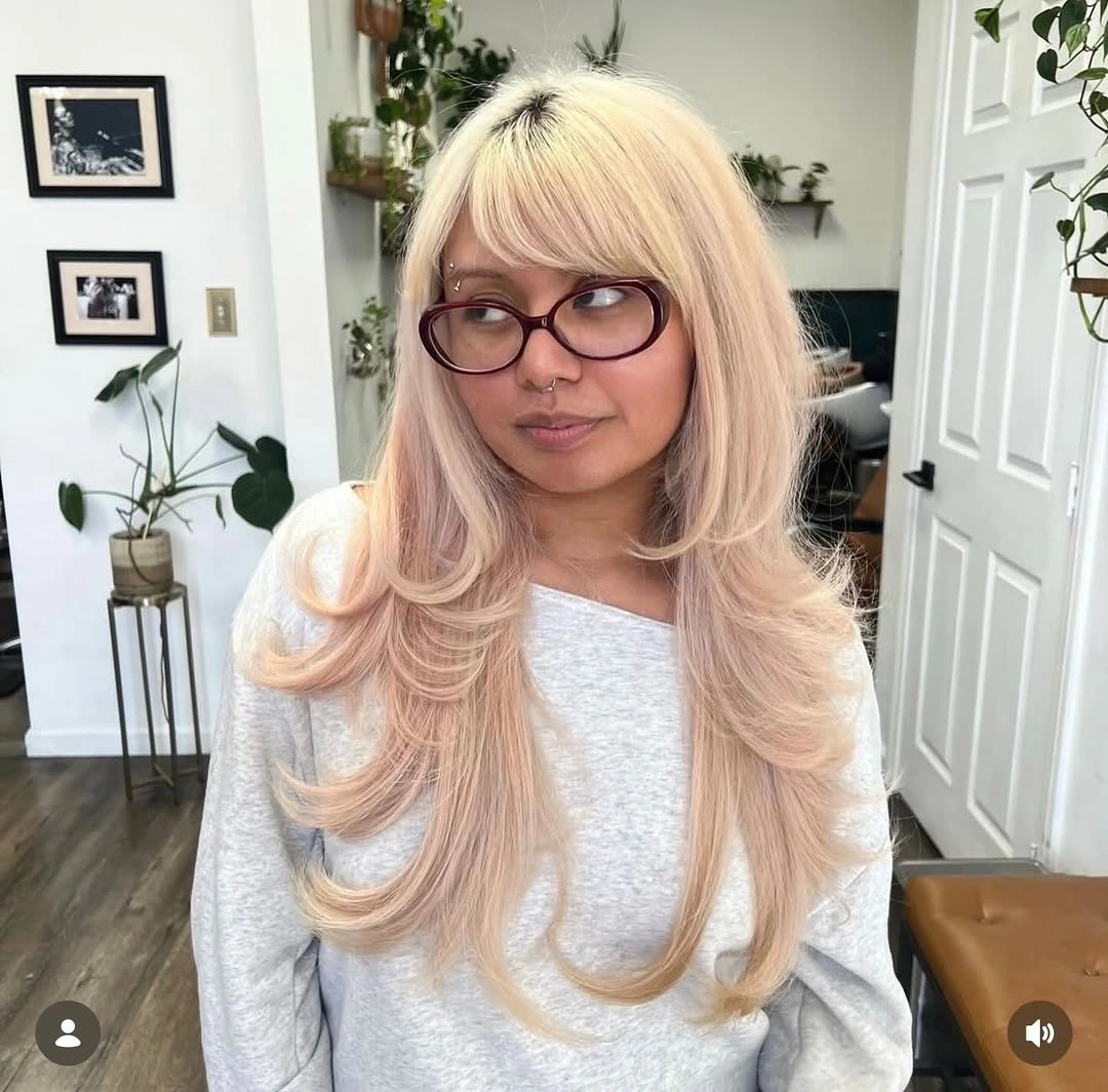 fall haircuts for women 2026 Butter Blonde Butterfly Layers With Airy Bangs