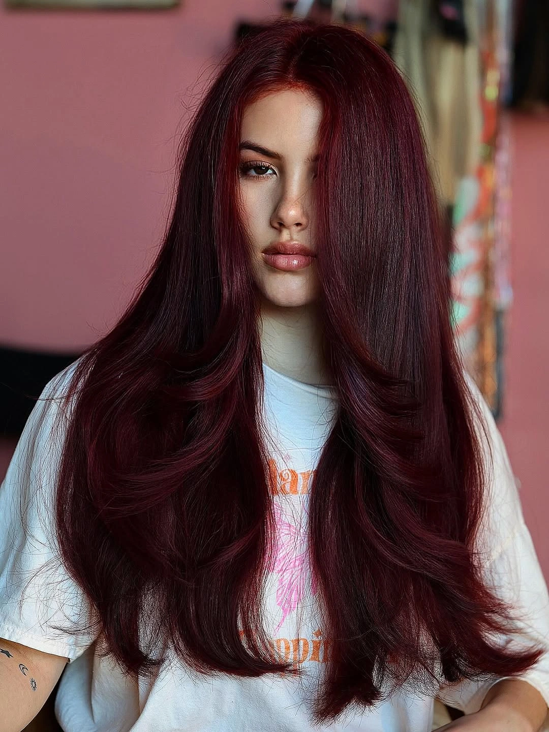 fall hairstyles 2026 Deep Burgundy Layers with a Mirror Shine
