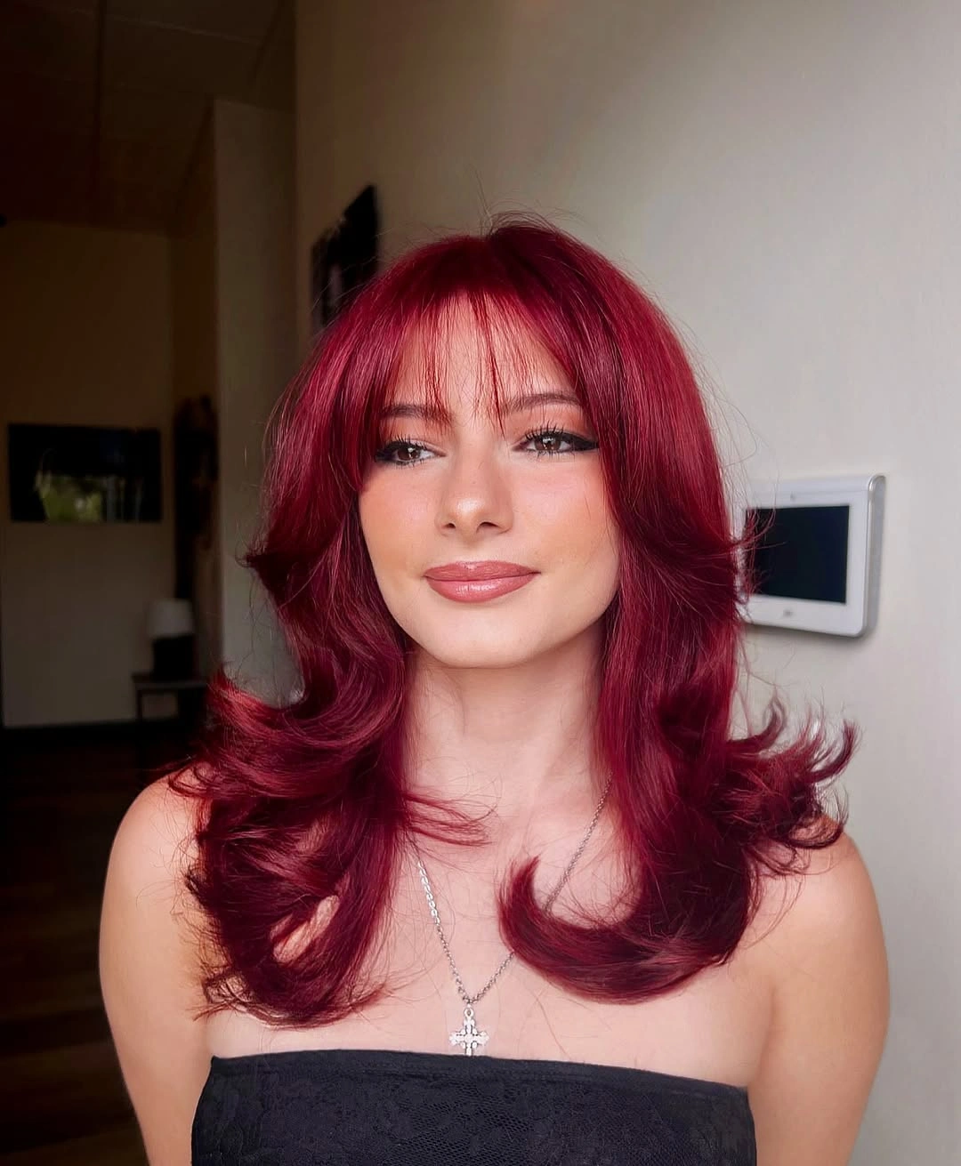 fall hairstyles 2026 Cherry Red Butterfly Layers with Soft Curtain Bangs