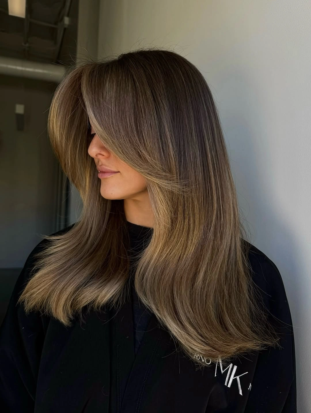 fall hairstyles 2026 Cool Beige Blowout with Sleek Curtain Layers