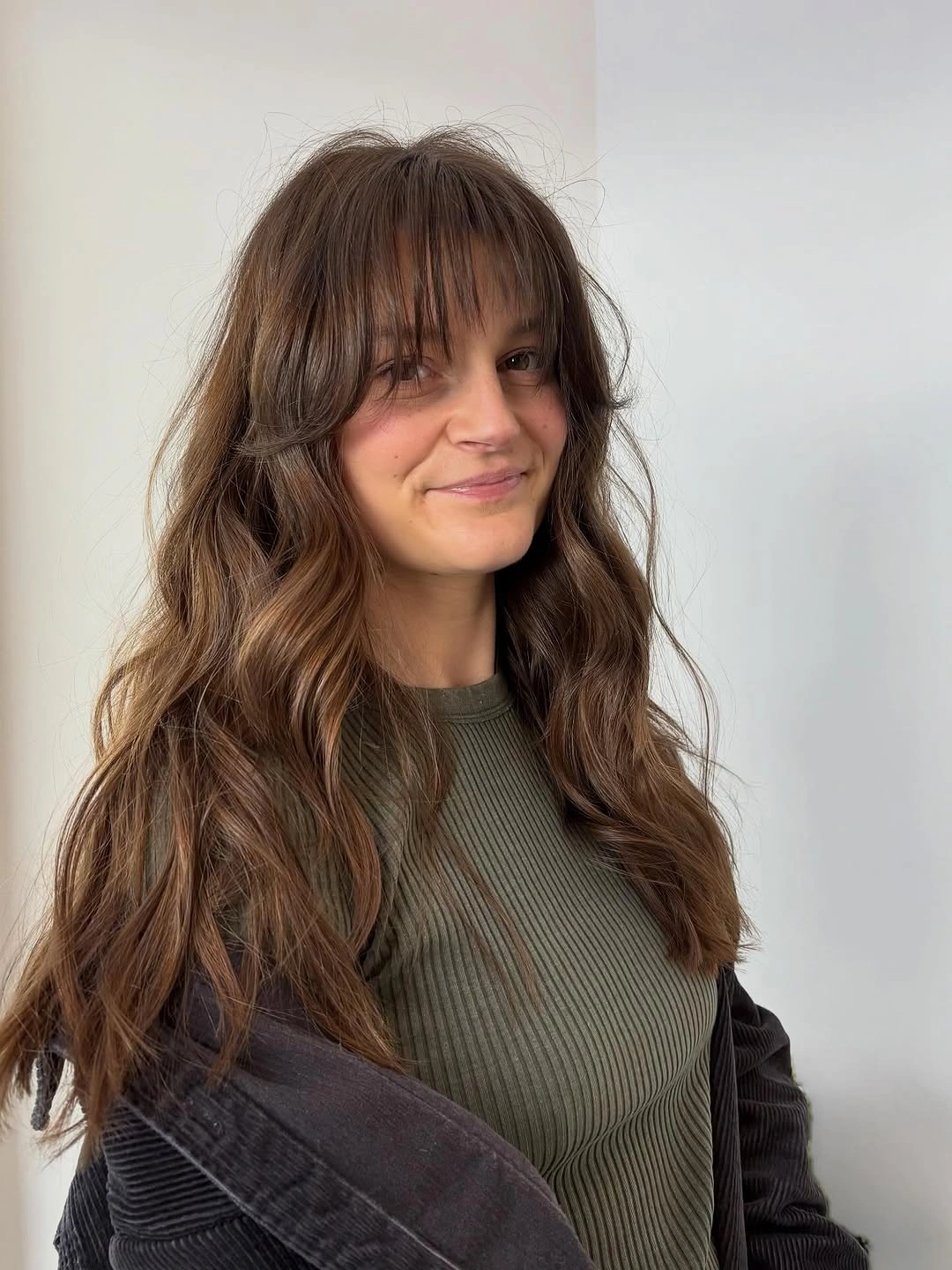 fall hairstyles for long hair 2026 Chocolate Waves With Soft Feathered Fringe