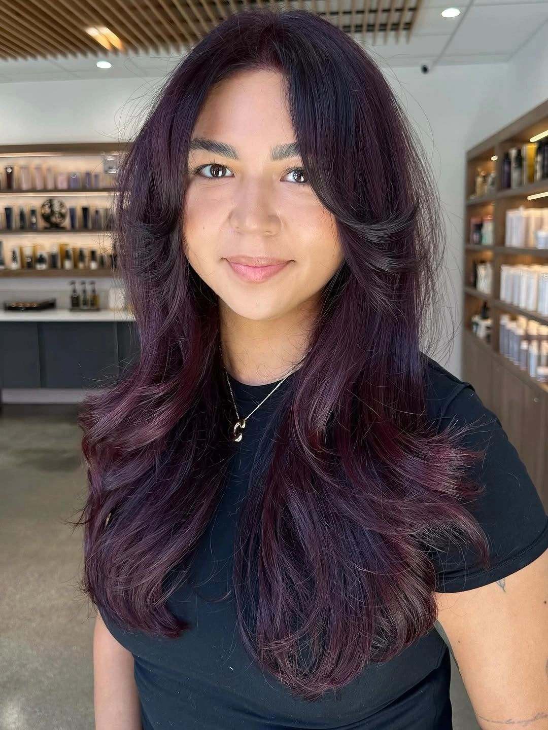 fall hairstyles for long hair 2026 Deep Plum Layers With Soft Curtain Bangs