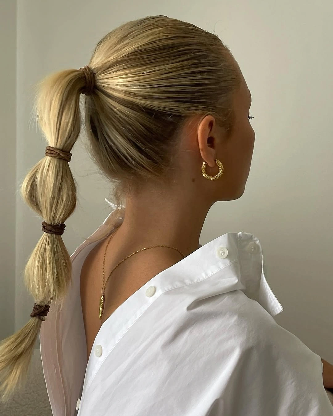 Fall hairstyles for office 2026 Bubble Ponytail with a Sleek Professional Finish