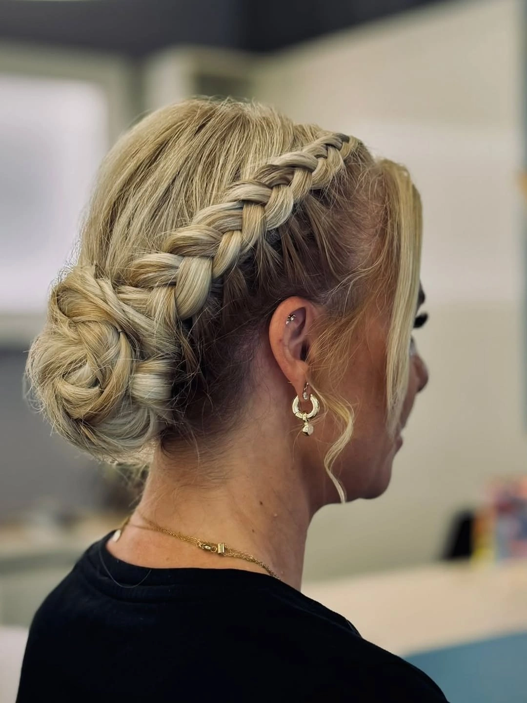 Fall hairstyles for office 2026 Braided Low Bun with Refined Detail