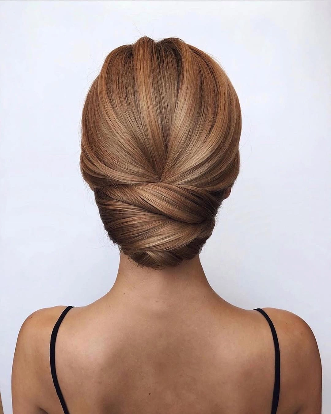 Fall hairstyles for office 2026 Elegant Twisted Low Chignon for Busy Office Mornings