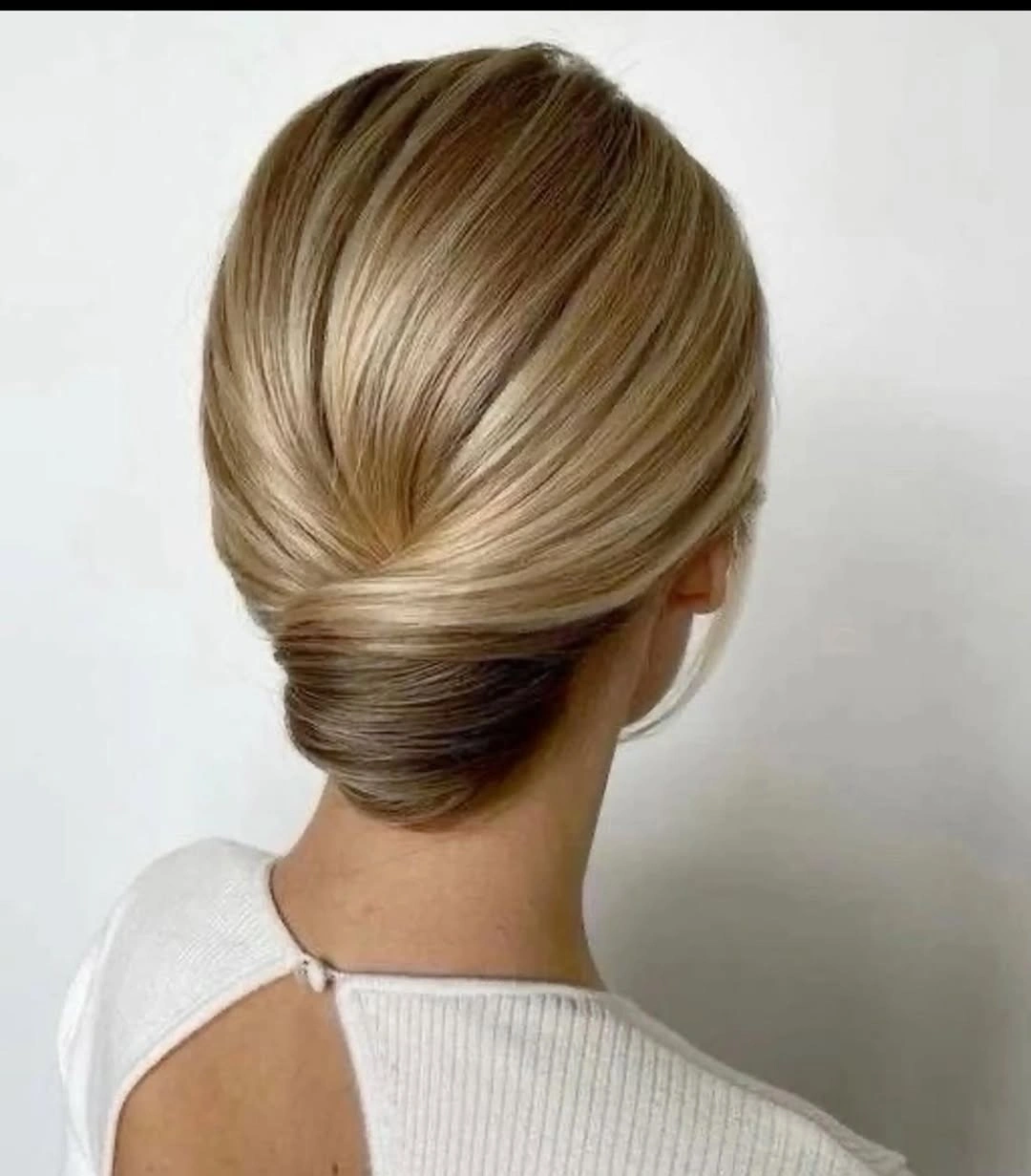 Fall hairstyles for office 2026 Minimalist Sleek Roll with Timeless Sophistication