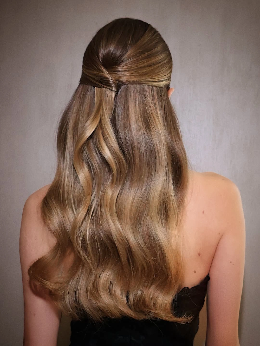 Fall hairstyles for wedding guests 2026 Elegant Twisted Half-Up Waves with a Satin Finish